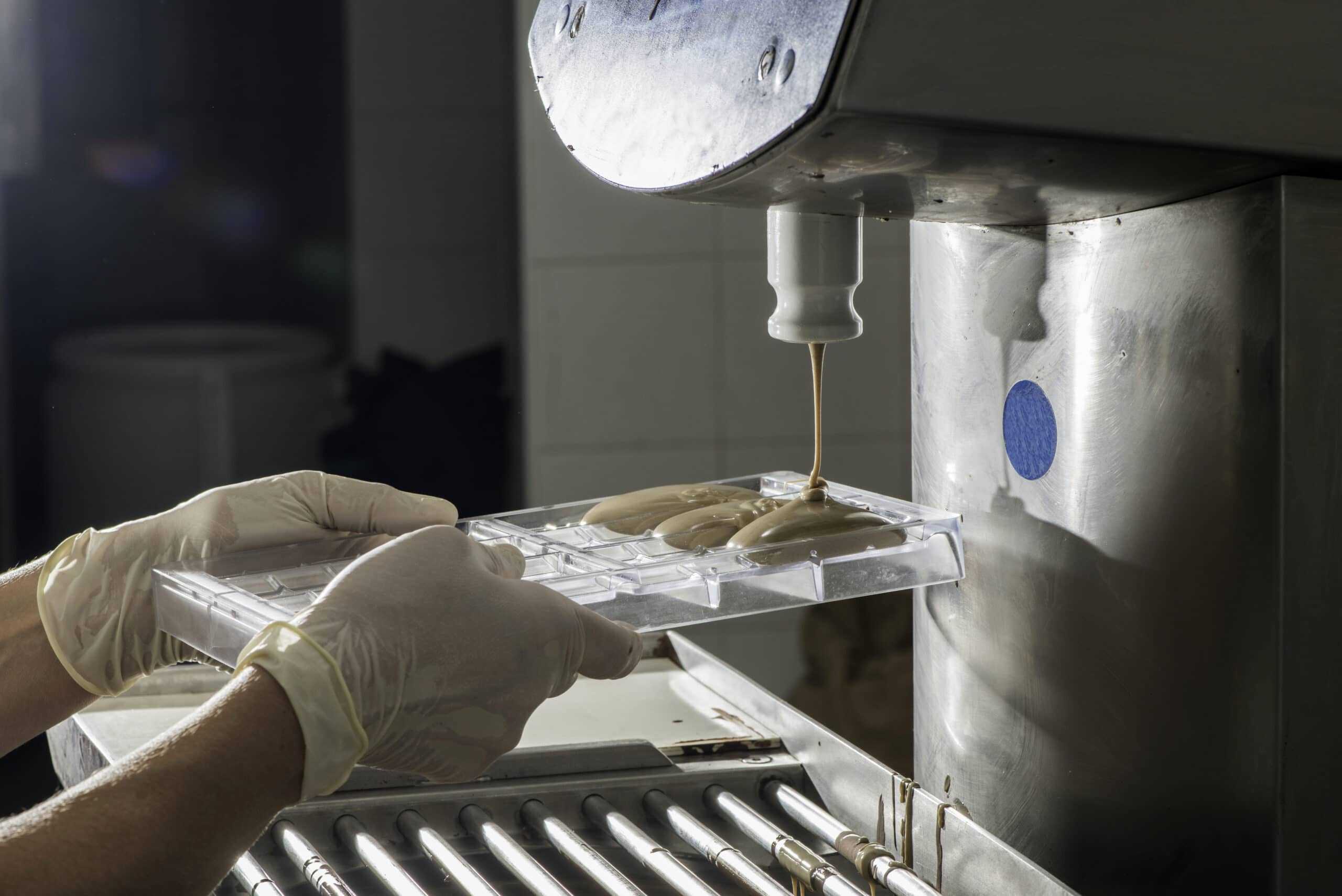 Picture of a worker making chocolate in a chocolate factory