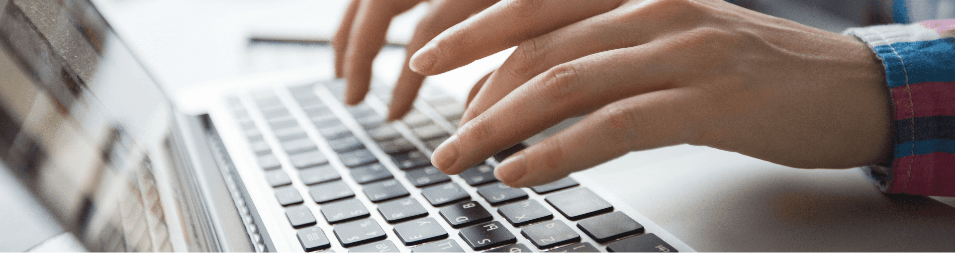 Someone typing on a keyboard