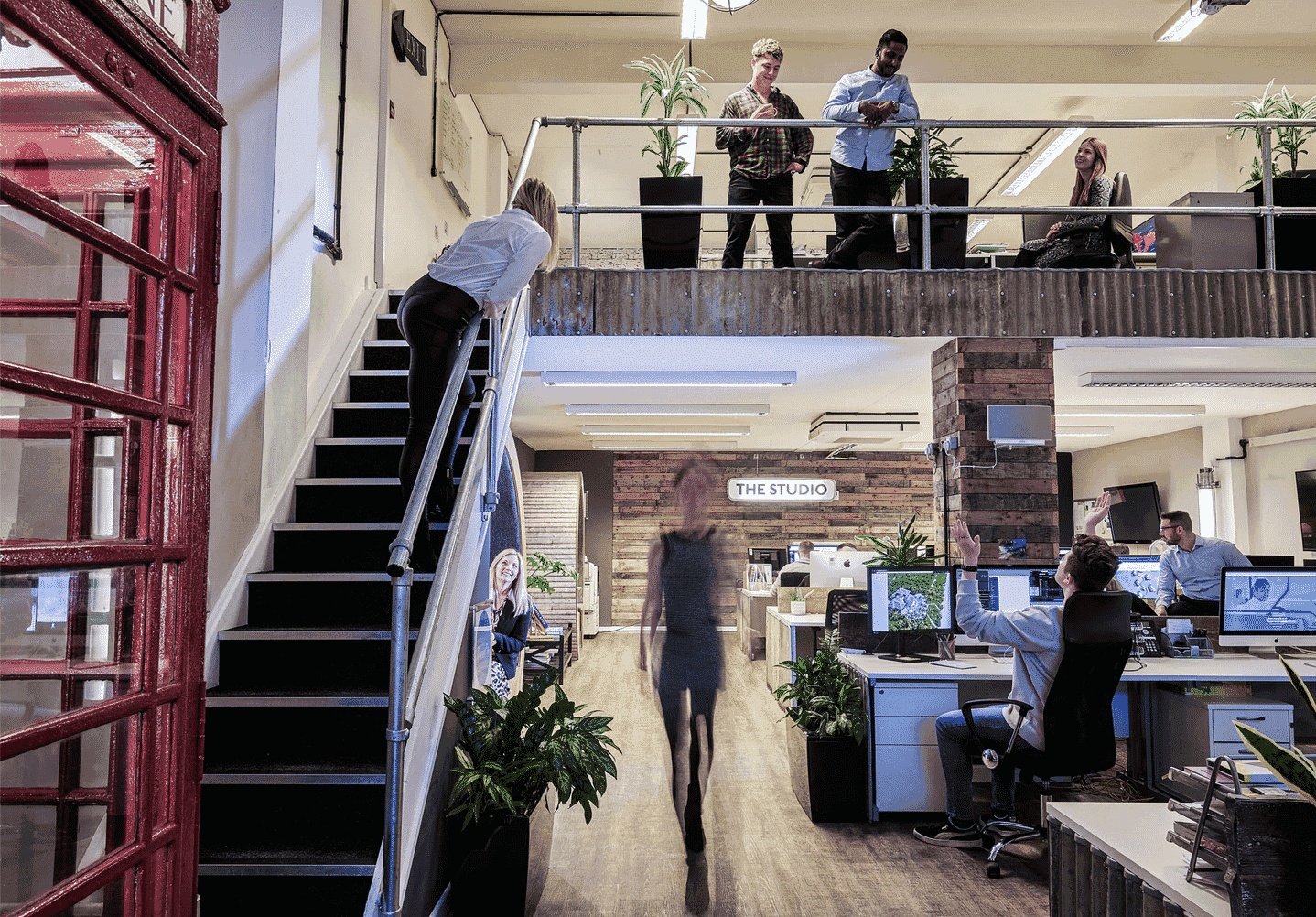 Picture of an office with workers in it